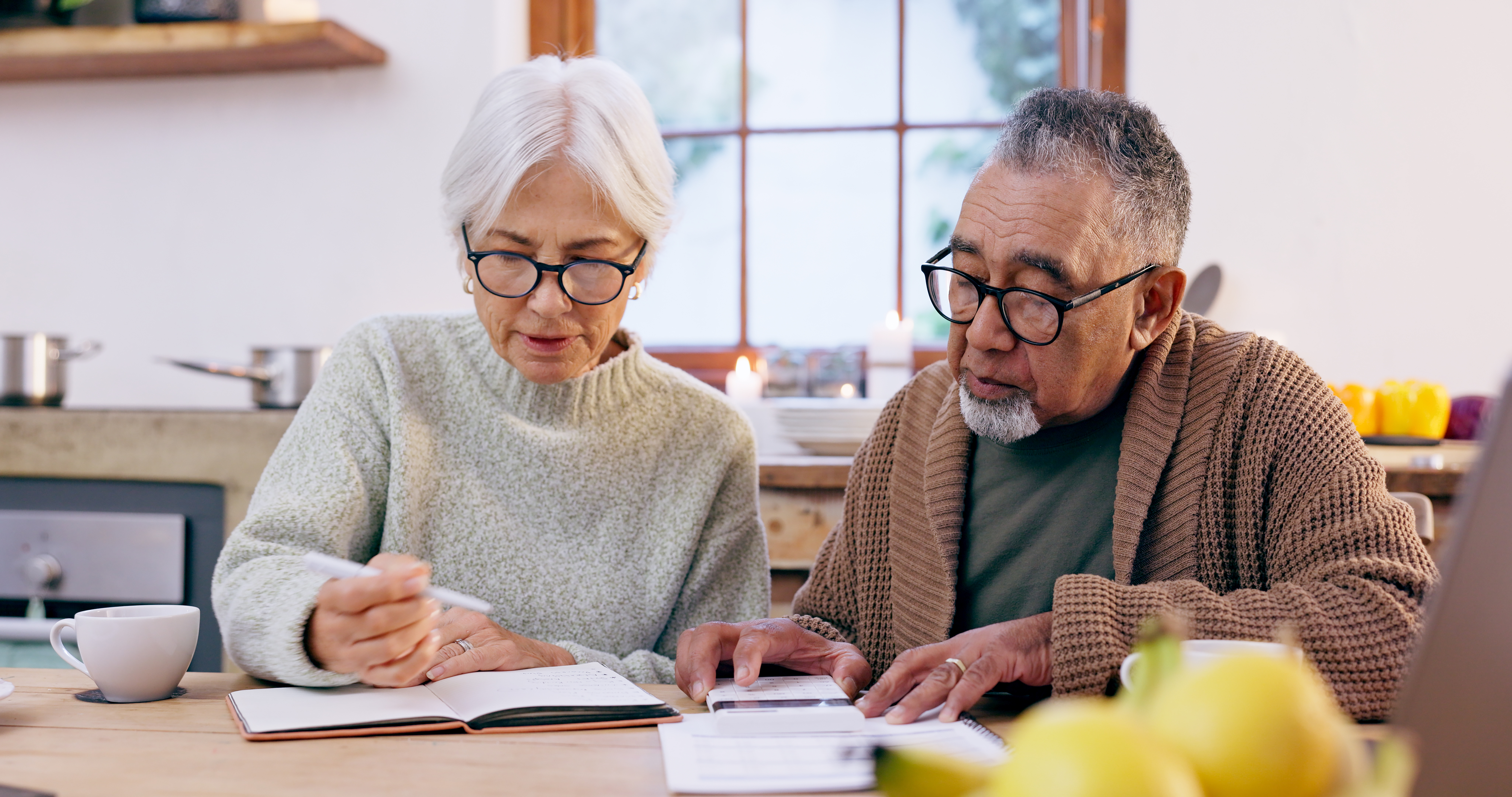 retired couple reviewing finances and planning retirement income strategy